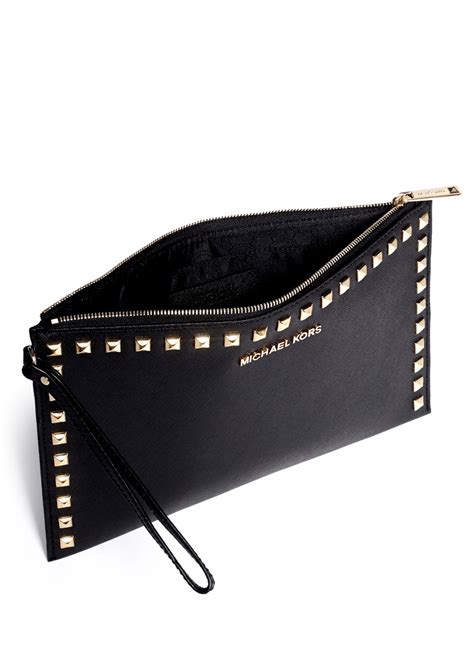 michael kors selma studded clutch black|michael kors designer clutch.